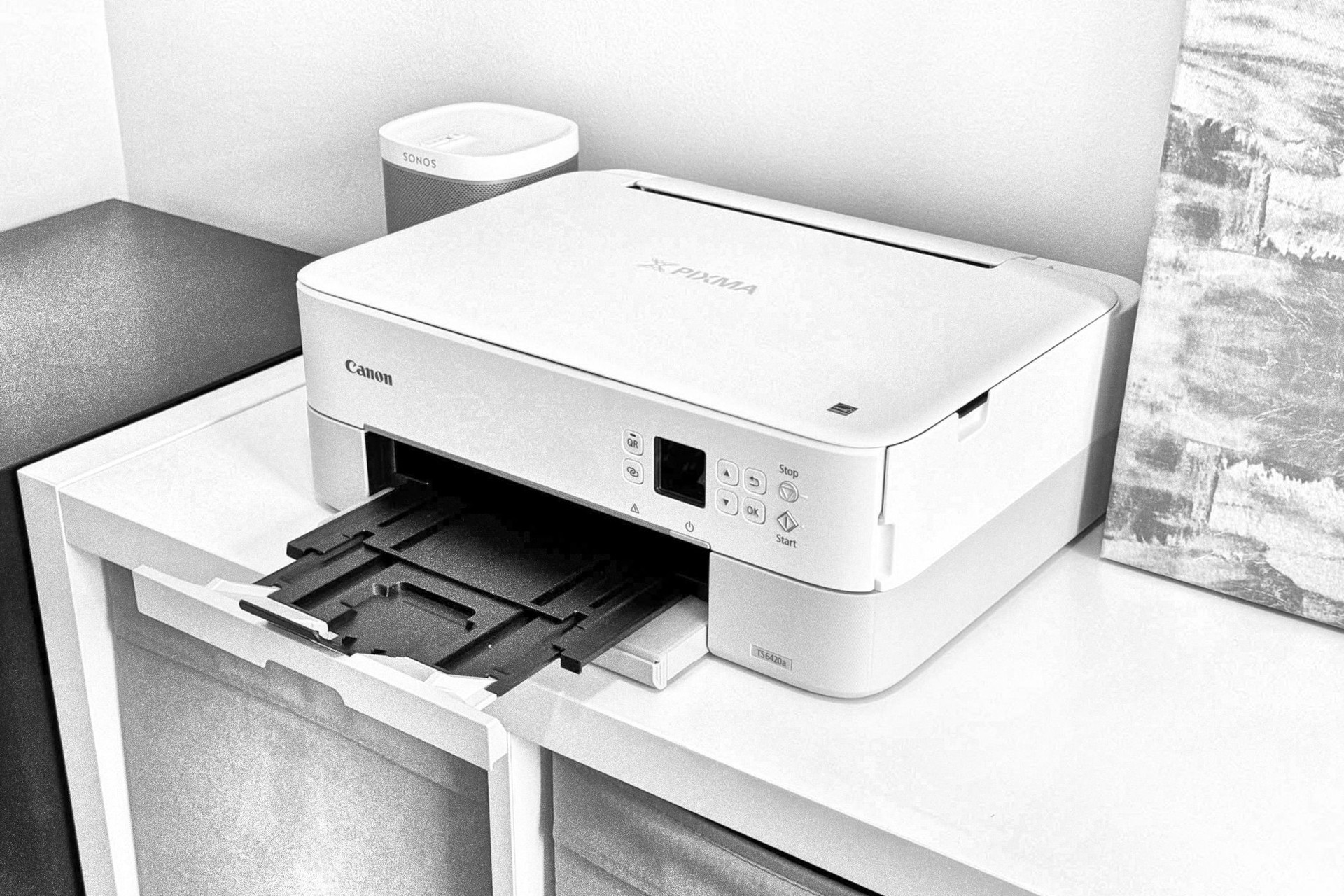 A Canon printer with the paper tray extended