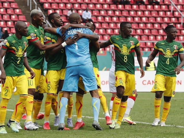 Mali's Ibrahim Mounkoro celebrates with teammates after saving a penalty from Tunisia's Wahbi Khazri on January 12, 2022