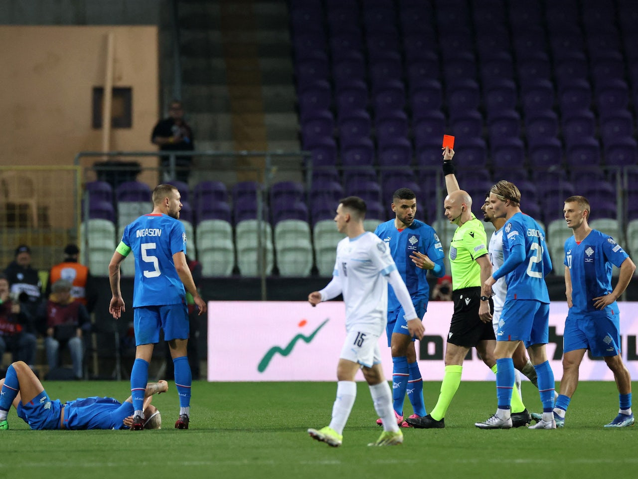 Israel's Roy Revivo is shown a red card by referee Anthony Taylor on March 21, 2024