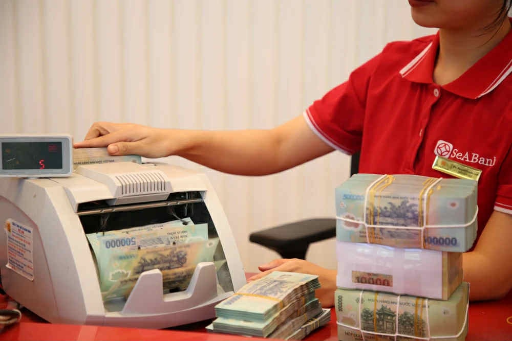 Ngân hàng giảm lãi suất tăng tín dụng cho doanh nghiệp tư nhân