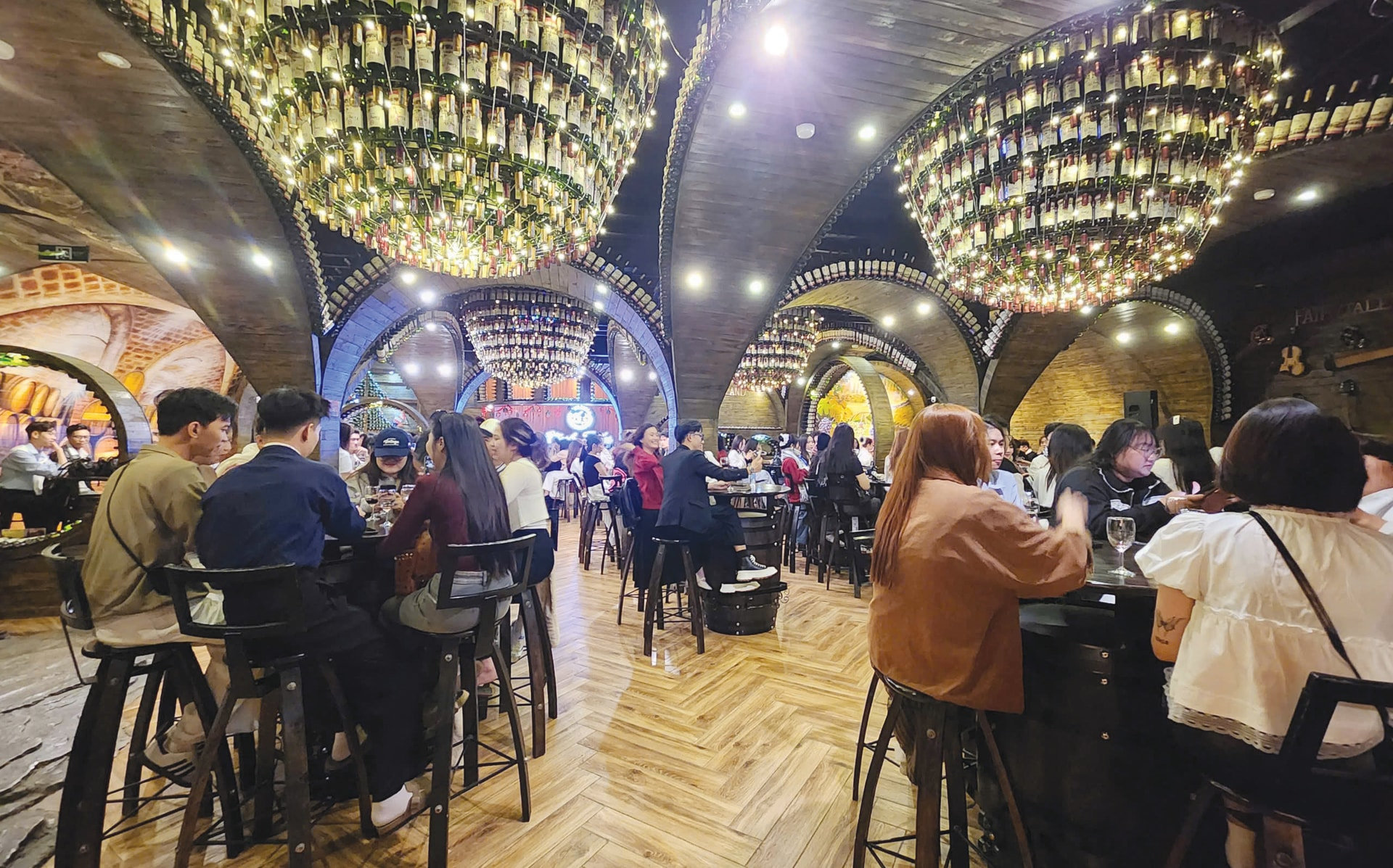 International tourists enjoy wine tasting experiences at Vinh Tien Wine Cellar in Cam Ly Ward, Da Lat
