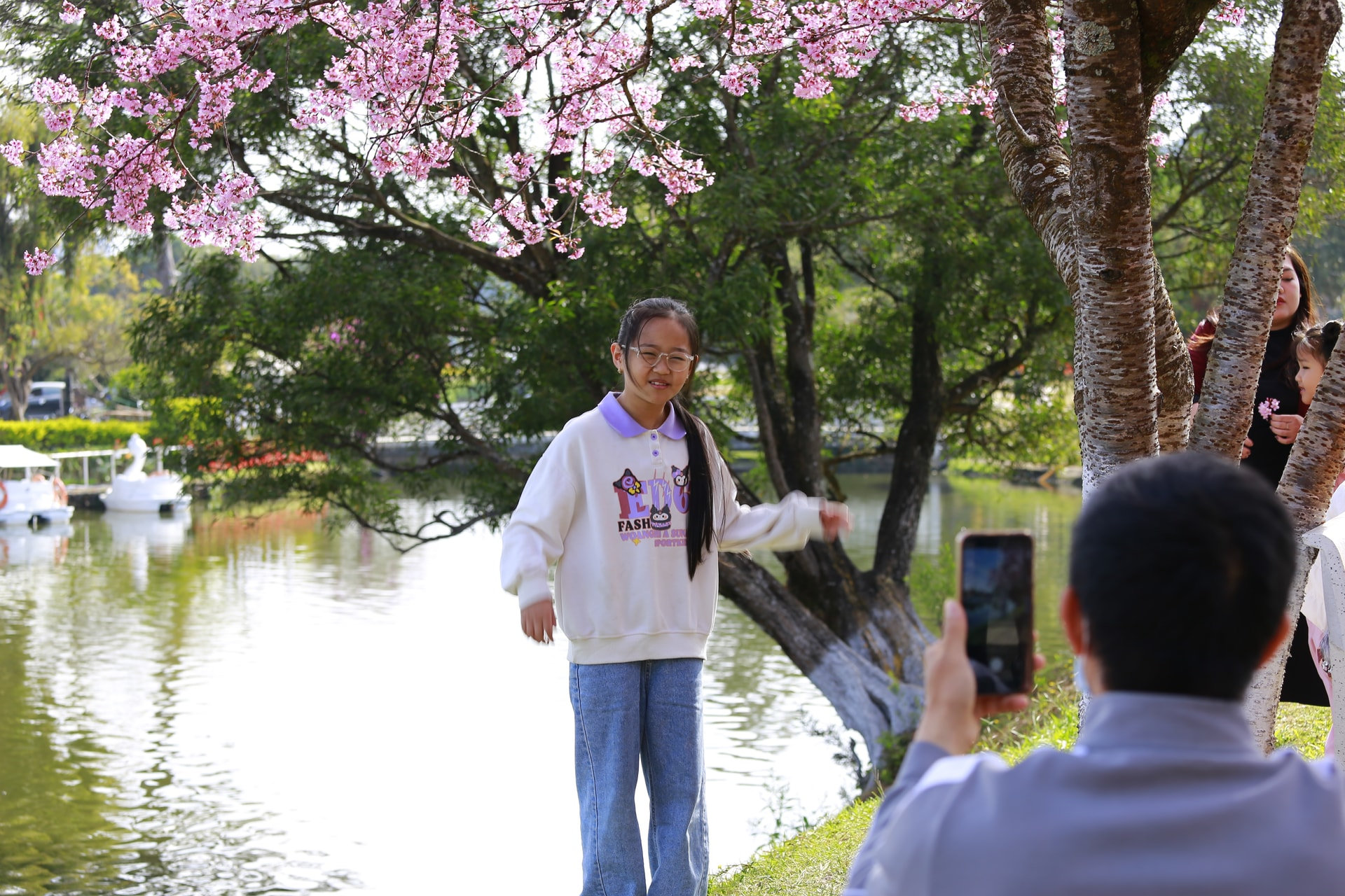 Many parents mark their children’s childhood memories beneath the cherry blossoms.