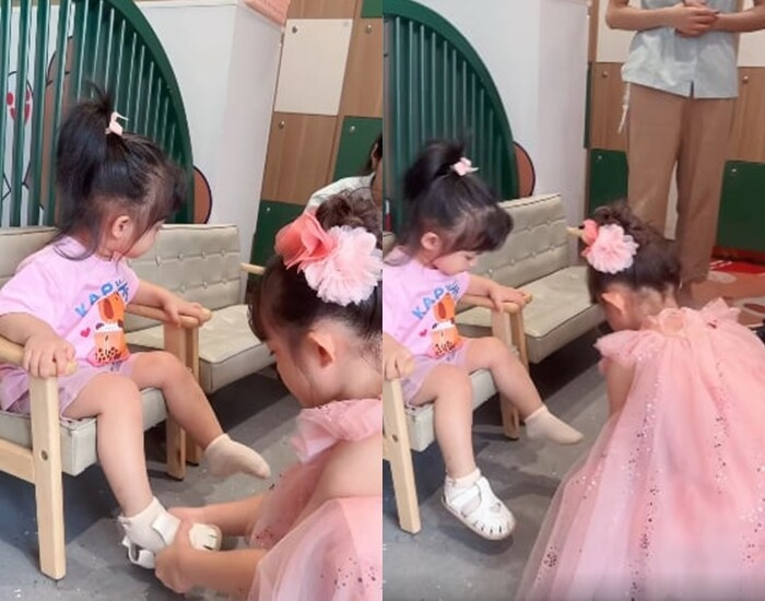 Từ bế ẵm đến giúp em tháo dép, cô cả nhà Đông Nhi đều làm thuần thục.