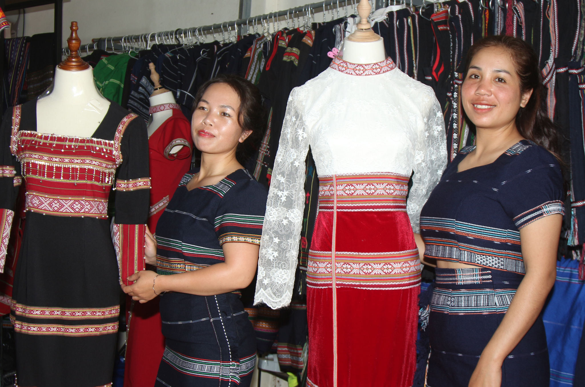 Ka Hoan (right) and her collaborators design brocade wedding dresses in a small village on the Di Linh Plateau