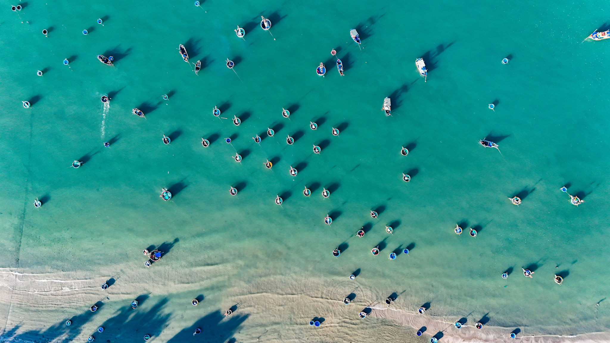 From above, the fishing village appears bustling, with hundreds of boats operating in the early morning hours