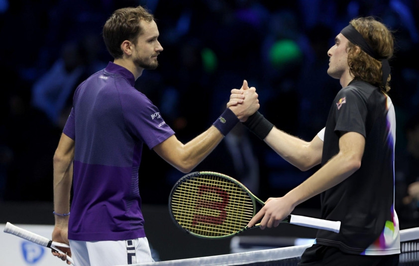 Daniil Medvedev and Stefanos Tsitsipas during a Grand Slam matchup.