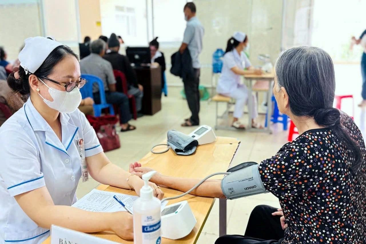 Blood pressure is measured during a free health check-up programme