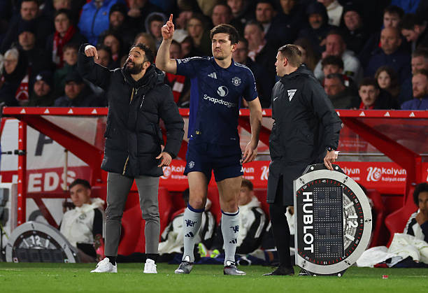 Maguire và Amorim khi cùng làm việc ở Man Utd. Ảnh: Getty Images.