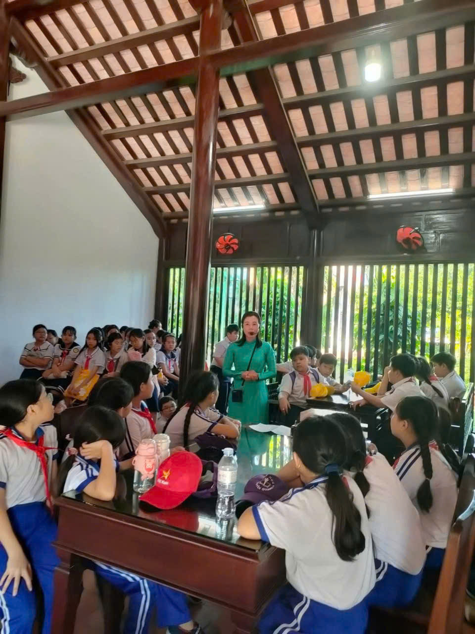 Students learn about President Ho Chi Minh during a visit to the Duc Thanh Relic Site.